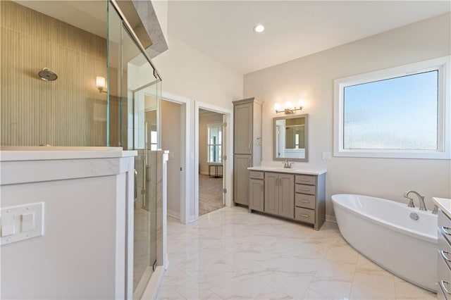 full bath with a healthy amount of sunlight, a stall shower, marble finish floor, and vanity