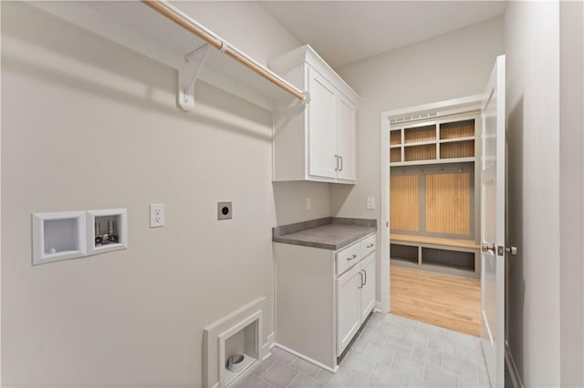 washroom with washer hookup, cabinet space, and hookup for an electric dryer