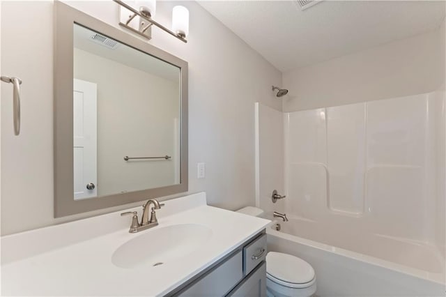 full bathroom featuring toilet, bathtub / shower combination, visible vents, and vanity