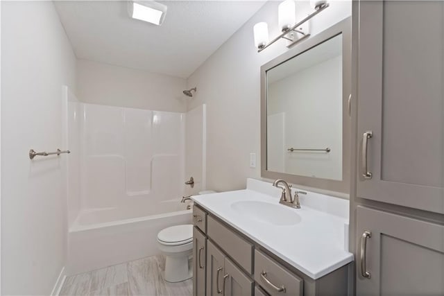 full bath featuring toilet, tub / shower combination, and vanity