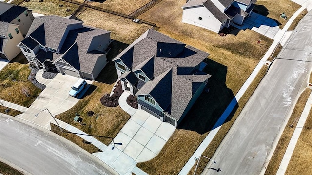 birds eye view of property with a residential view