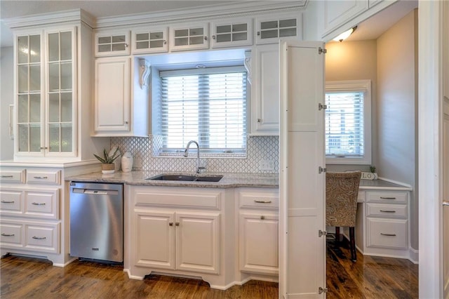 kitchen featuring dark wood-type flooring, sink, white cabinets, and stainless steel dishwasher