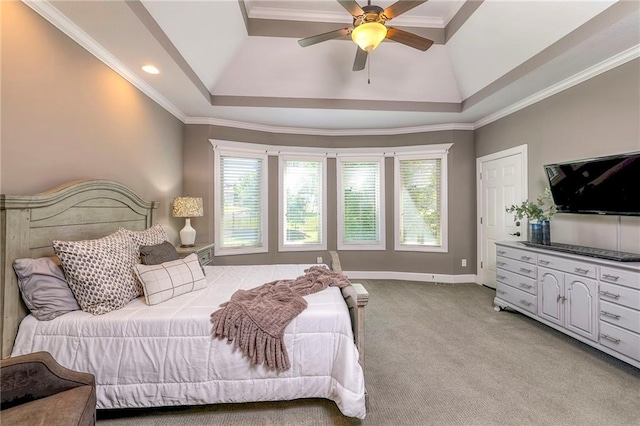 bedroom with light colored carpet, ceiling fan, ornamental molding, and a tray ceiling