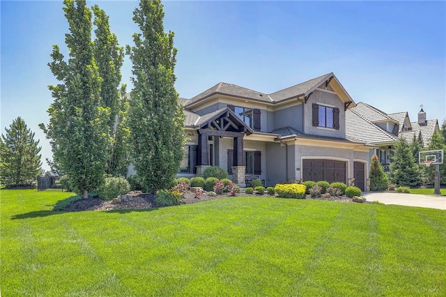 craftsman inspired home with a front lawn and a garage