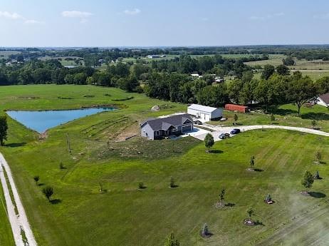 drone / aerial view featuring a rural view and a water view