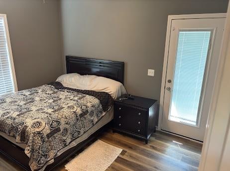 bedroom with hardwood / wood-style floors