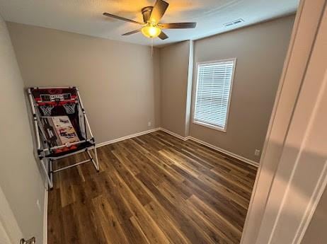 unfurnished bedroom with ceiling fan and hardwood / wood-style flooring