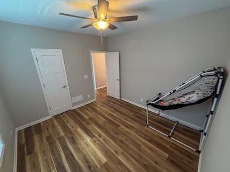 interior space with hardwood / wood-style flooring and ceiling fan