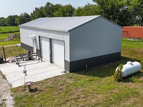 garage with a lawn