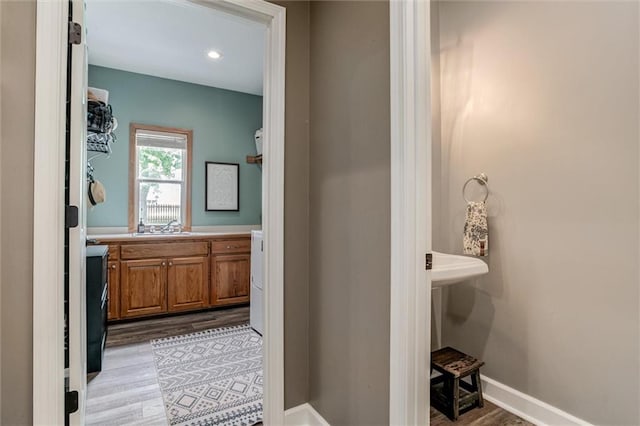 bathroom with hardwood / wood-style flooring and vanity