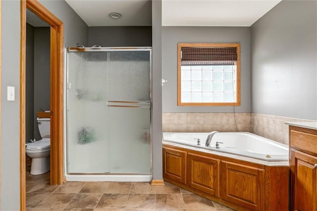 bathroom featuring tile patterned flooring, independent shower and bath, and toilet