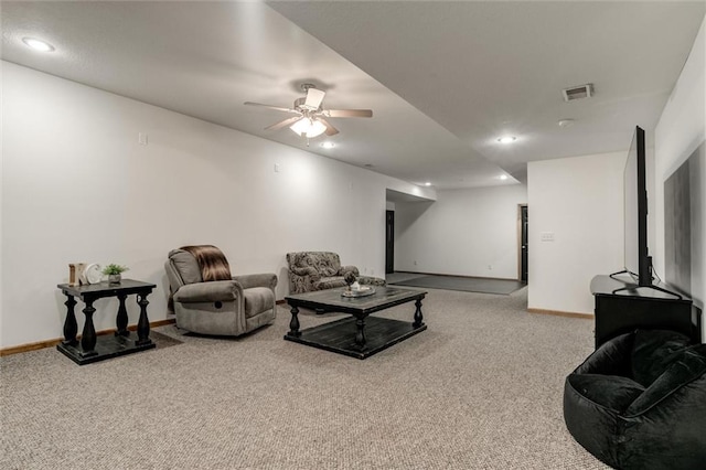 carpeted living room featuring ceiling fan