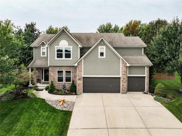 view of front of home with a garage and a front lawn