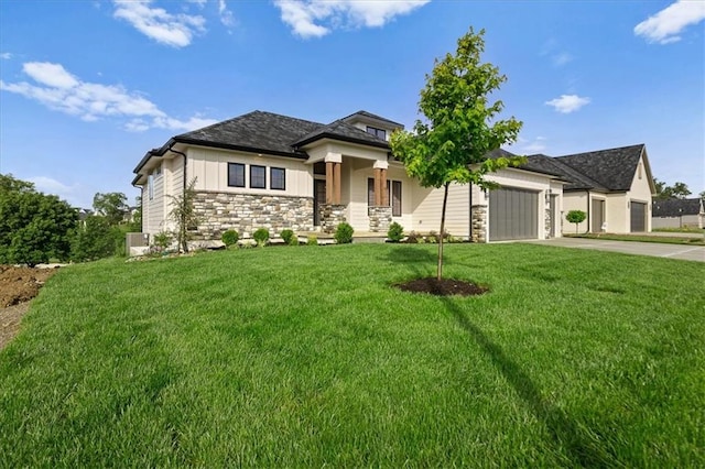 8732 N Lewis Ave, Kansas City, MO 64157 - prairie-style house with stone siding, driveway, an attached garage, a front lawn, and central air condition unit