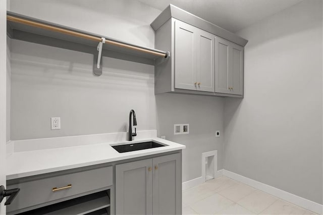 8732 N Lewis Ave, Kansas City, MO 64157 - washroom with electric dryer hookup, hookup for a washing machine, cabinet space, baseboards, and light marble finish flooring