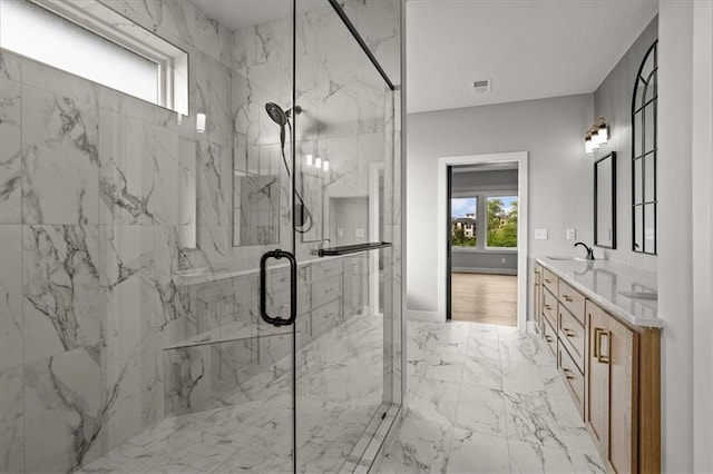 8732 N Lewis Ave, Kansas City, MO 64157 - full bathroom with a marble finish shower, double vanity, and marble finish floors