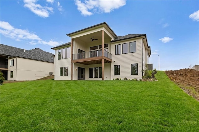 8732 N Lewis Ave, Kansas City, MO 64157 - back of property featuring a balcony, a lawn, and ceiling fan