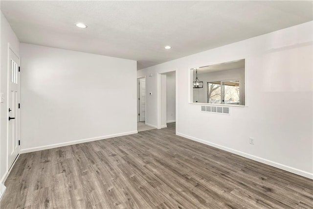 spare room featuring hardwood / wood-style floors