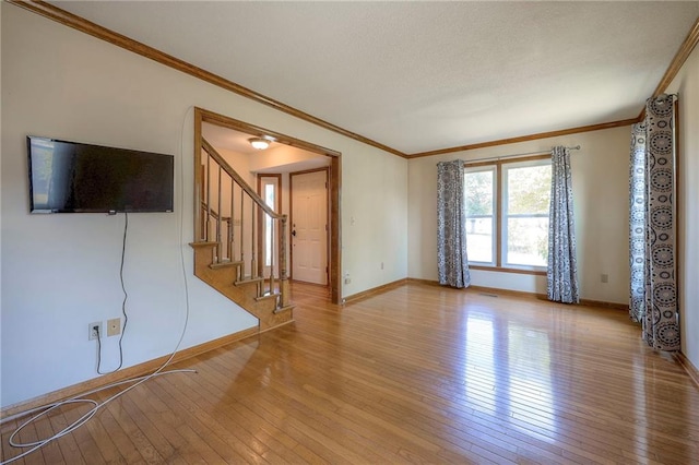 unfurnished living room with light wood-type flooring and crown molding