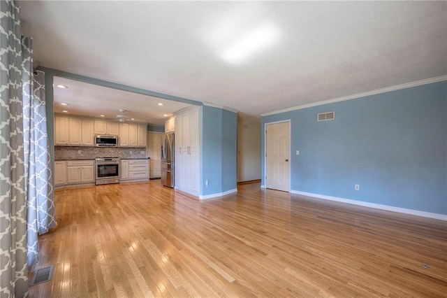 unfurnished living room with ornamental molding and light hardwood / wood-style flooring