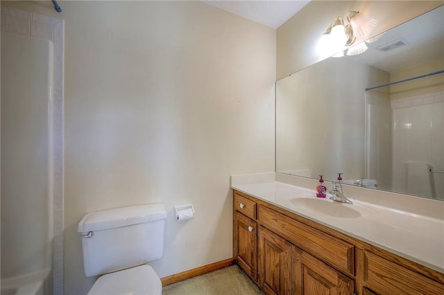 bathroom featuring toilet and vanity