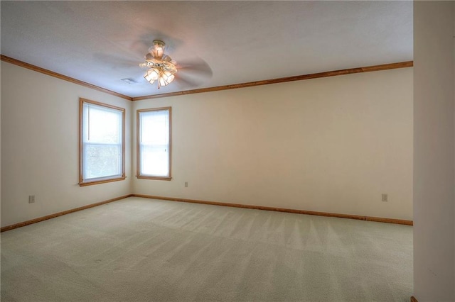 unfurnished room featuring ceiling fan, light carpet, and ornamental molding