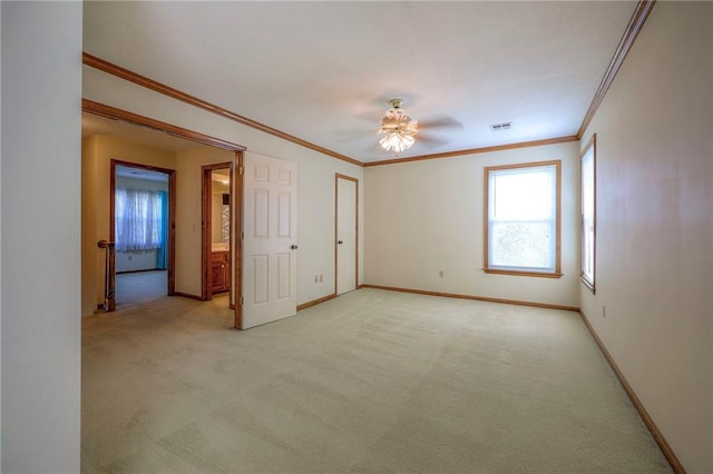 unfurnished bedroom with crown molding, ceiling fan, and light carpet