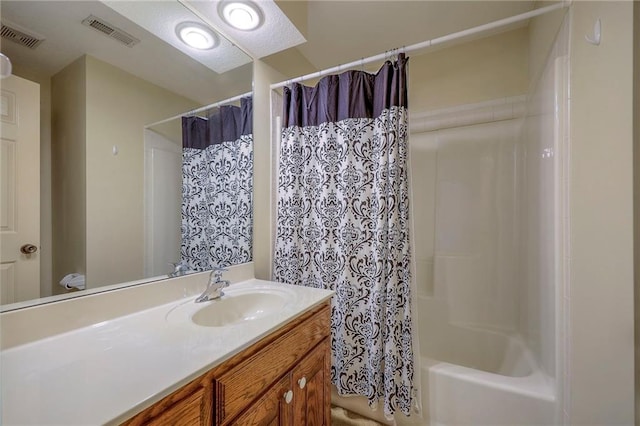 bathroom with vanity and shower / bathtub combination with curtain