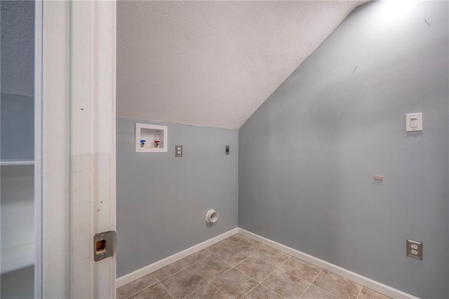 clothes washing area featuring washer hookup, a textured ceiling, and hookup for an electric dryer