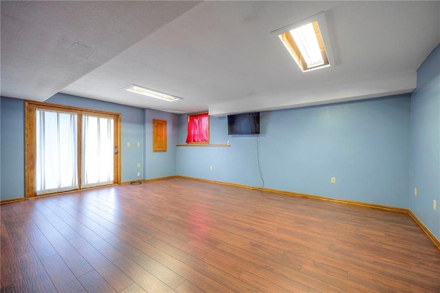 empty room with hardwood / wood-style flooring