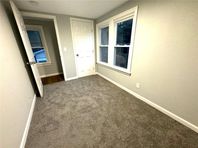 unfurnished bedroom with carpet