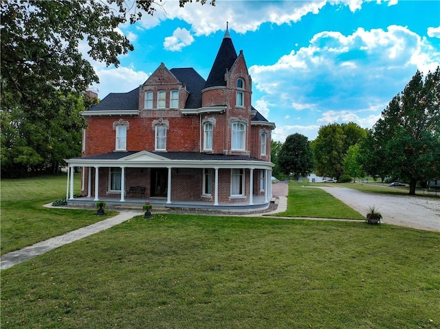 view of front of property with a front yard and a porch