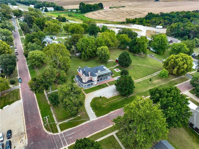 birds eye view of property featuring a rural view