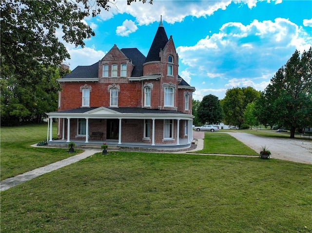 view of front of home featuring a front yard and a porch