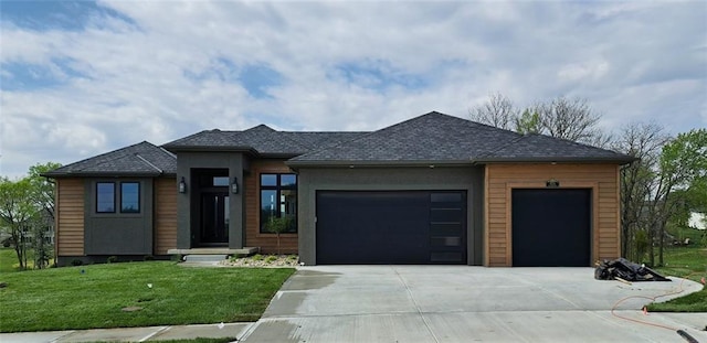 8720 N Lewis Ave, Kansas City, MO 64157 - prairie-style home with a garage, driveway, and a front lawn