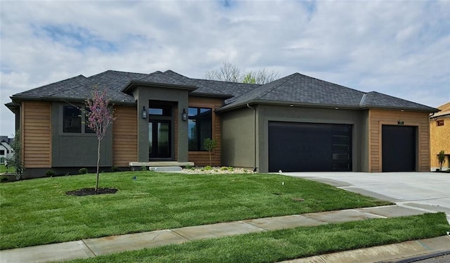 8720 N Lewis Ave, Kansas City, MO 64157 - prairie-style house featuring concrete driveway, a garage, and a front yard