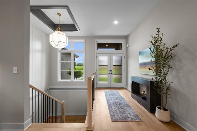 8720 N Lewis Ave, Kansas City, MO 64157 - foyer with wood finished floors, french doors, and baseboards