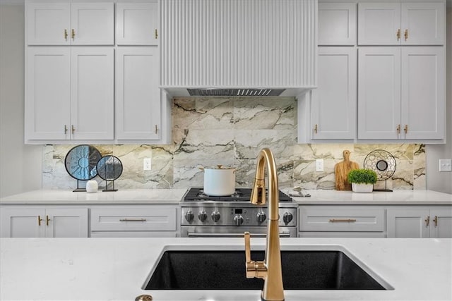 8720 N Lewis Ave, Kansas City, MO 64157 - kitchen with custom range hood, white cabinetry, tasteful backsplash, and a sink