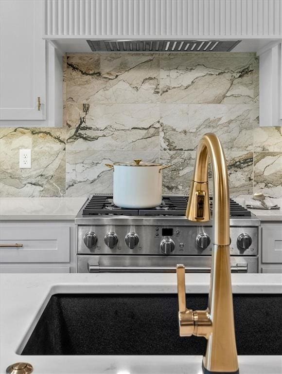 8720 N Lewis Ave, Kansas City, MO 64157 - kitchen view of tasteful backsplash and white cabinetry