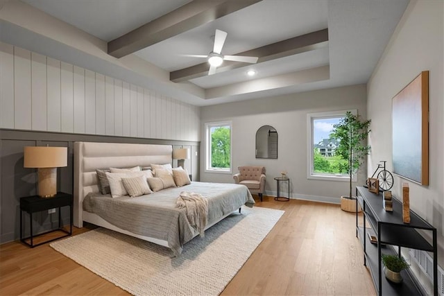 8720 N Lewis Ave, Kansas City, MO 64157 - bedroom with light wood-style flooring, beamed ceiling, a ceiling fan, and baseboards