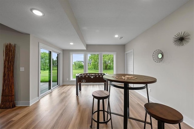 8720 N Lewis Ave, Kansas City, MO 64157 - dining room with baseboards, light wood finished floors, and recessed lighting