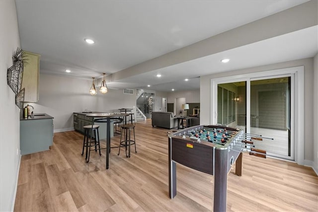 8720 N Lewis Ave, Kansas City, MO 64157 - rec room featuring light wood-style floors, baseboards, and recessed lighting