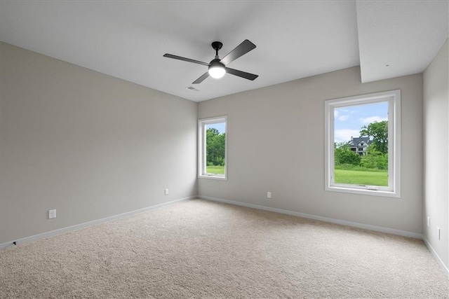 8720 N Lewis Ave, Kansas City, MO 64157 - carpeted spare room featuring baseboards and ceiling fan