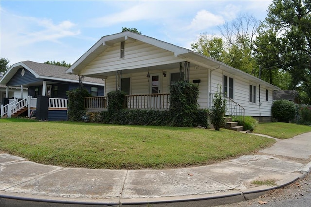 view of front of property with covered porch and a front yard