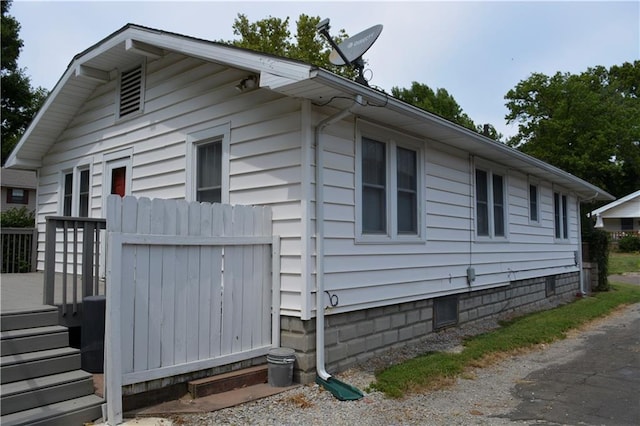 view of side of property with fence