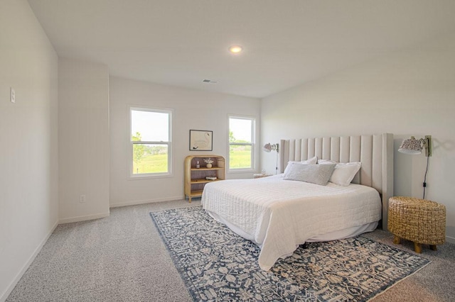 bedroom featuring carpet, visible vents, baseboards, and recessed lighting