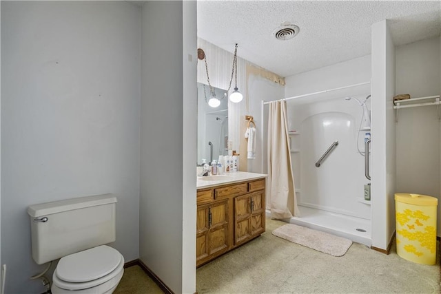 bathroom featuring a textured ceiling, toilet, a shower with shower curtain, and vanity