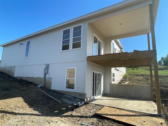 rear view of house featuring a patio