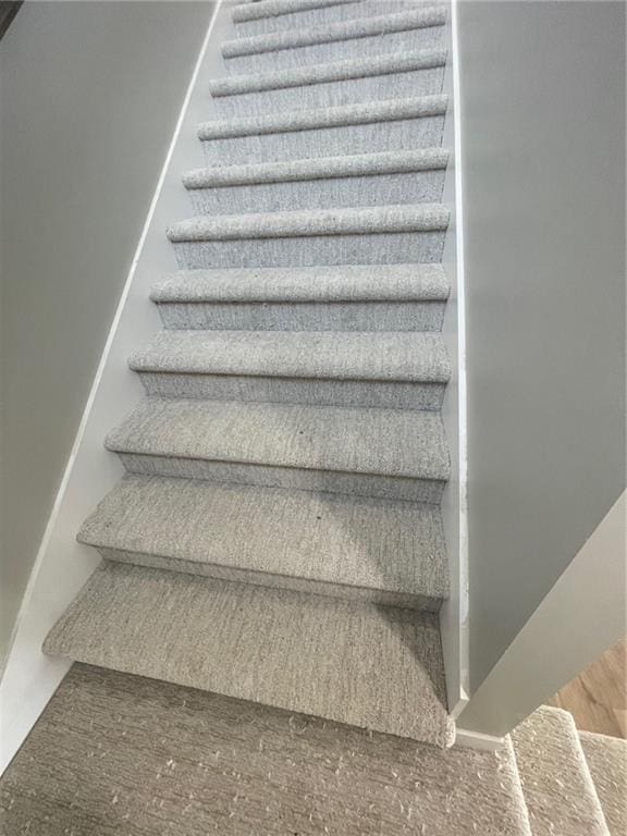 stairs with hardwood / wood-style floors