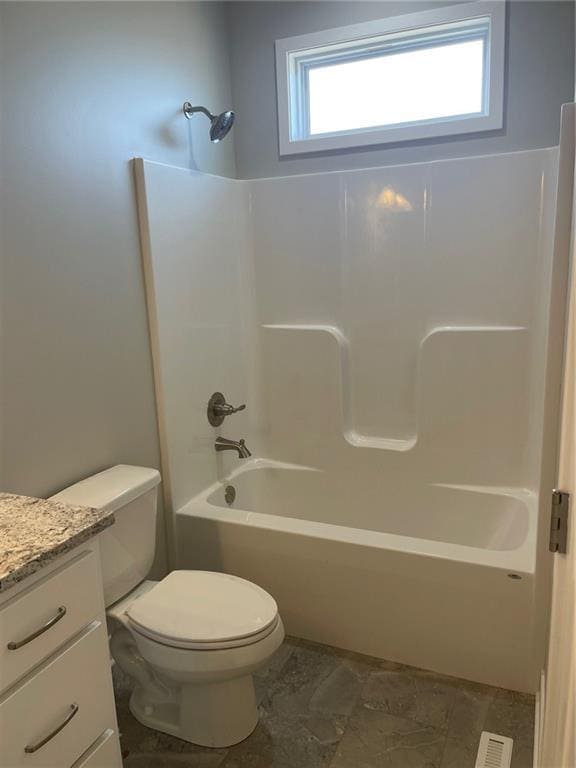 full bathroom featuring shower / bath combination, vanity, and toilet